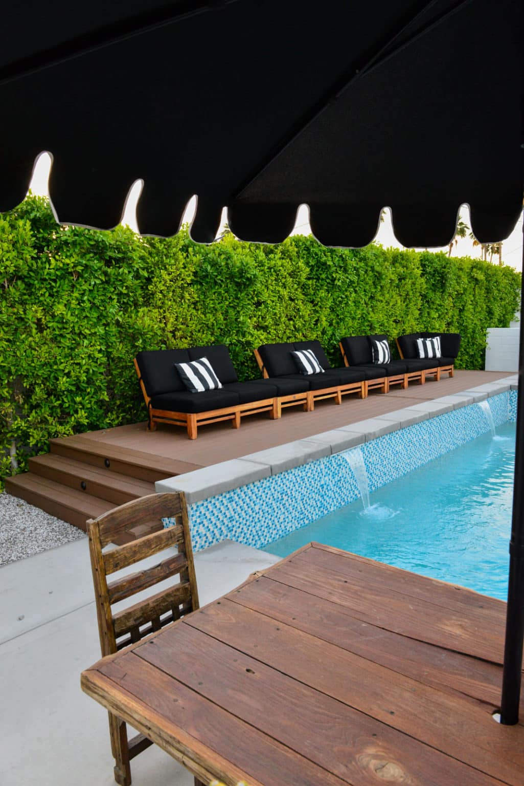 Backyard landscape transformation in Palm Springs including multi-level composite decking, hardscape, fire feature, breeze block, masonry, low voltage lighting, artificial turf, irrigation and desert plants.