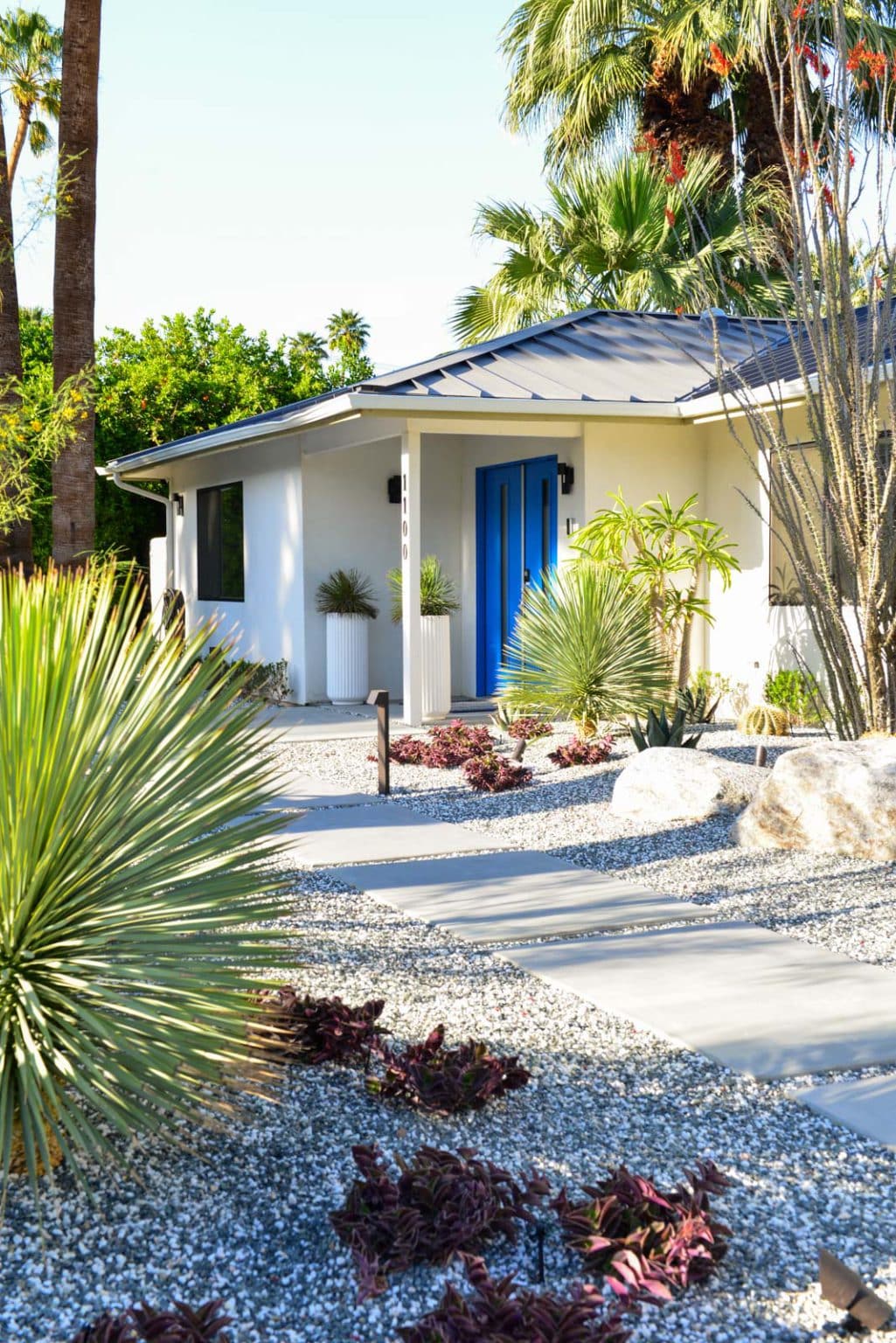 Complete landscape transformation in Palm Springs. Installation includes acid washed hardscape layout, outdoor living area with pizza oven, BBQ, Fireplace, Outdoor shower with breeze block, low voltage lighting, boulders, irrigation and desert plants. Design also includes new driveway automatic gate and new pedestrian entry gate and new garden walls in front yard.