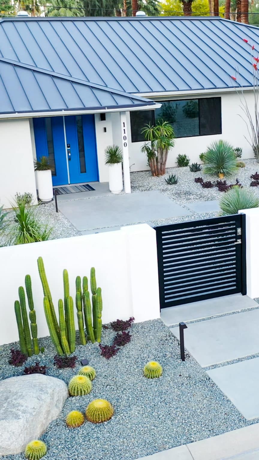 Complete landscape transformation in Palm Springs. Installation includes acid washed hardscape layout, outdoor living area with pizza oven, BBQ, Fireplace, Outdoor shower with breeze block, low voltage lighting, boulders, irrigation and desert plants. Design also includes new driveway automatic gate and new pedestrian entry gate and new garden walls in front yard.