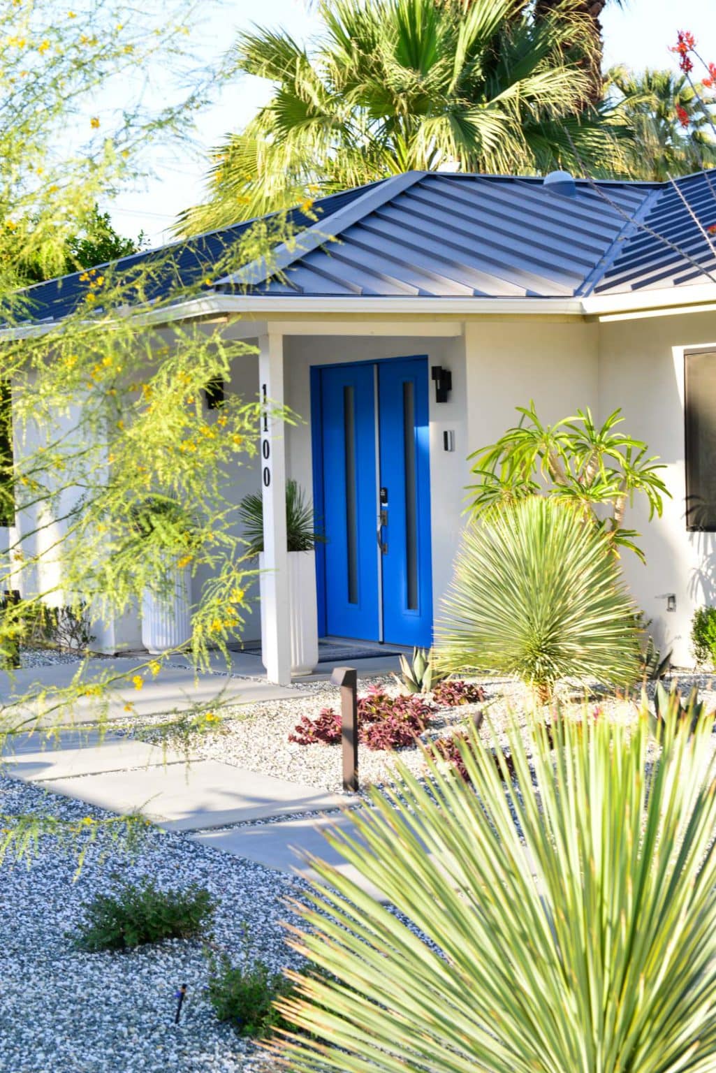 Complete landscape transformation in Palm Springs. Installation includes acid washed hardscape layout, outdoor living area with pizza oven, BBQ, Fireplace, Outdoor shower with breeze block, low voltage lighting, boulders, irrigation and desert plants. Design also includes new driveway automatic gate and new pedestrian entry gate and new garden walls in front yard.